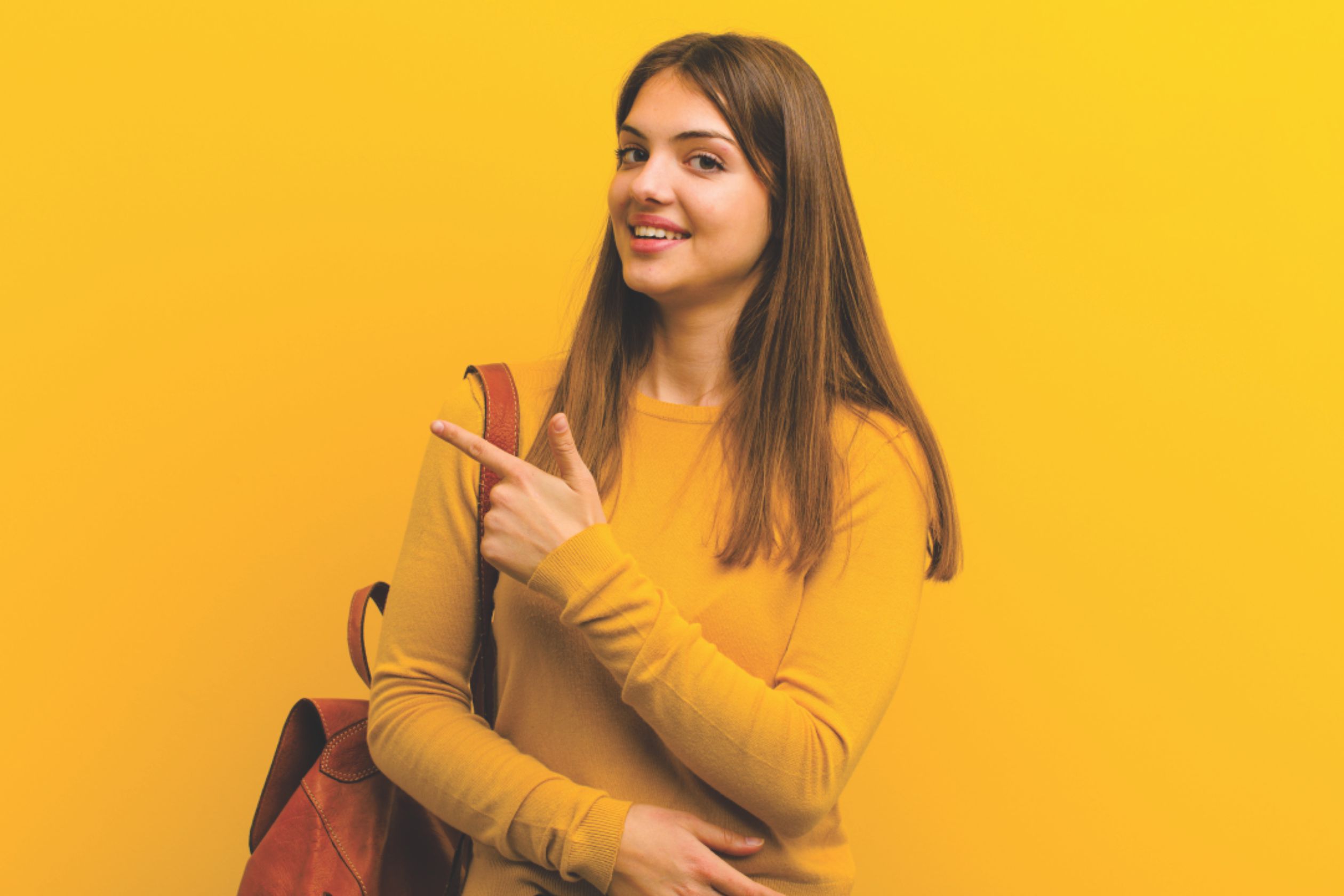 A happy girl student wearing a yellow outfit and carrying a school bag after receiving expert guidance from Tagore Educons – best admission consultancy in Patna.